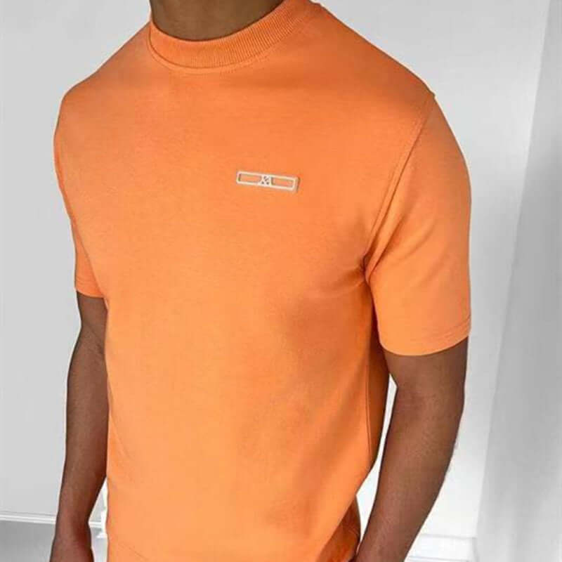 Men's casual sports t-shirt in bright orange with a crew neck, ideal for sports and everyday wear.