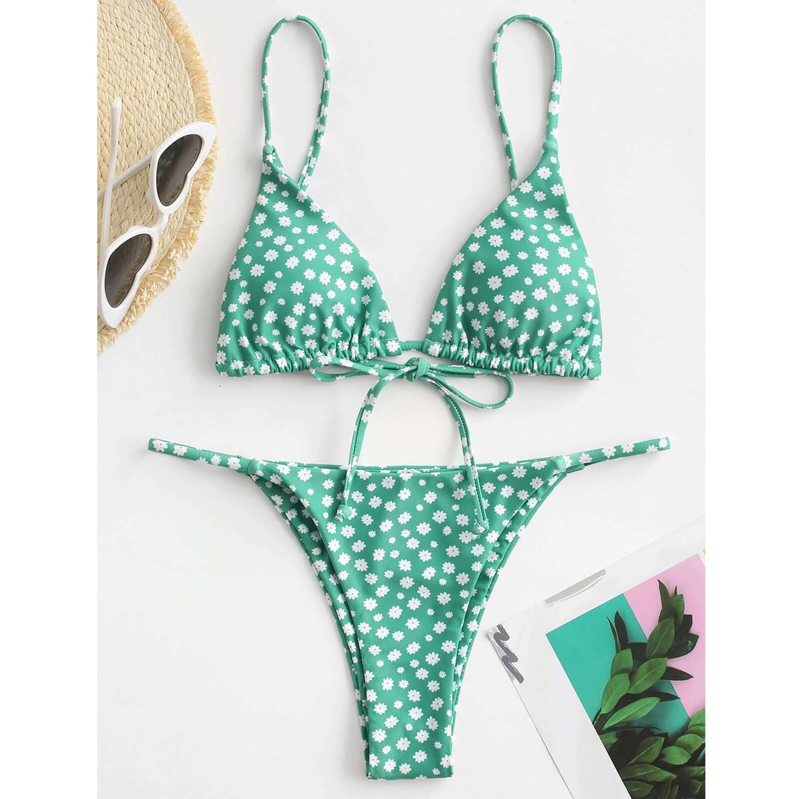 Green floral print bikini set with adjustable straps, stylish design perfect for summer beachwear.