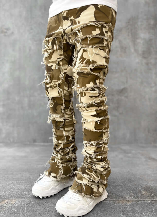 Men's camo patched stacked jeans with distressed detailing, stylish and comfortable pants for casual wear.