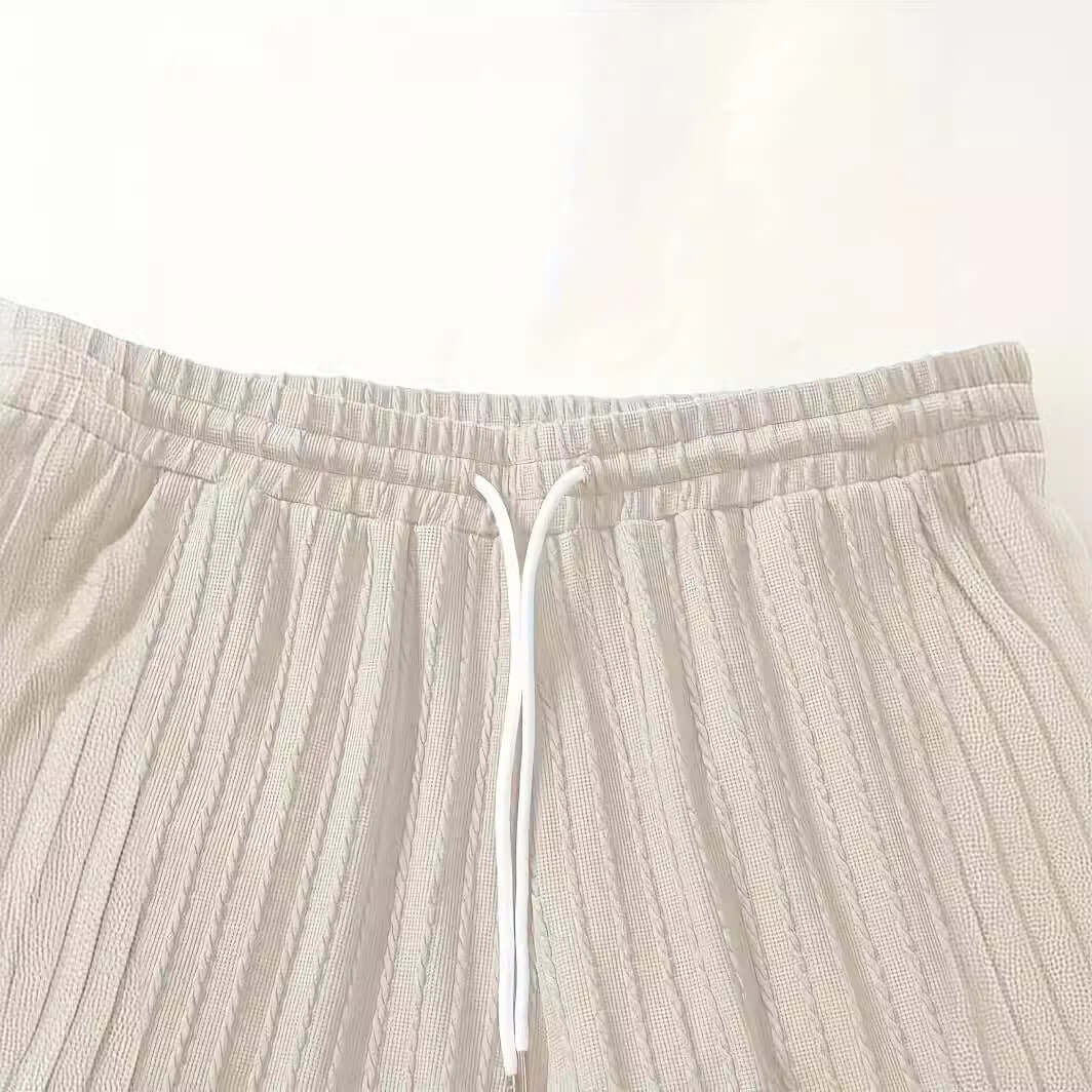 Men's milky white casual shorts with elastic waistband and drawstring detail, perfect for summer wear.