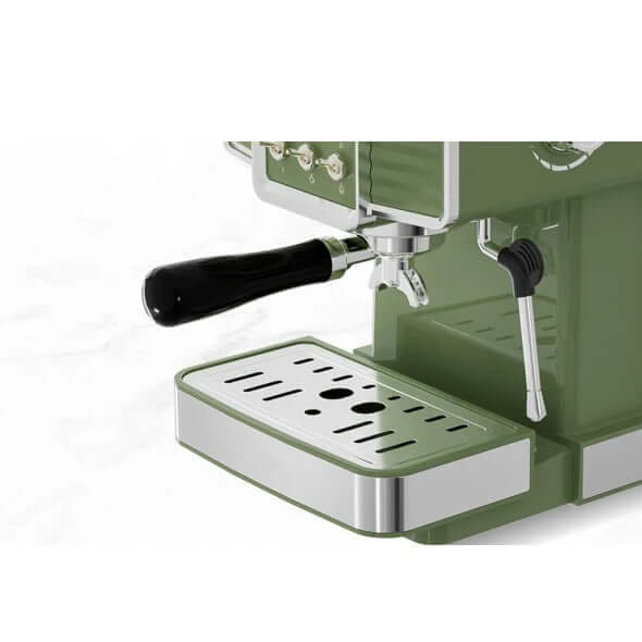 Close-up of green 15 bar espresso coffee machine with milk frother steam wand on a counter, showcasing its modern design and components.