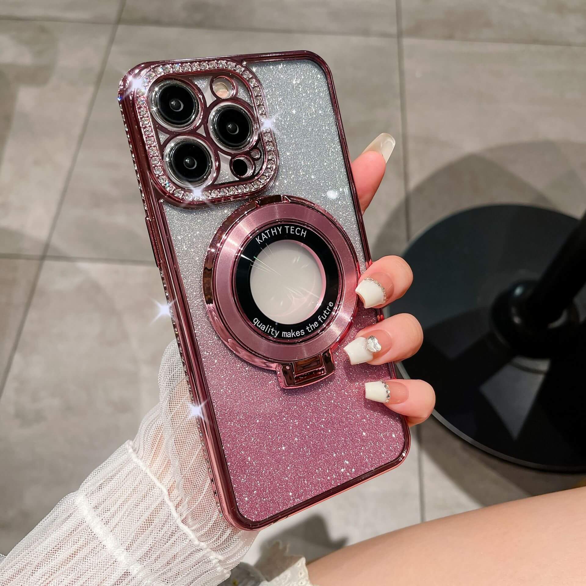 Glitter TPU electroplating magnetic bracket phone case in pink with rhinestones, showcasing a trendy and stylish design.