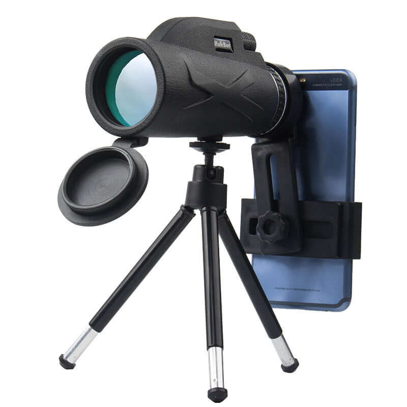 Outdoor monocular with night vision, attached to smartphone on tripod, perfect for astronomy and military use.