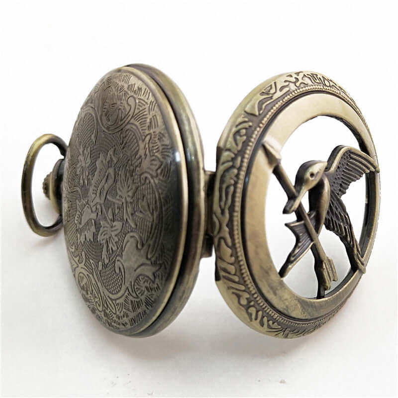 Antique large bird arrow pocket watch showcasing intricate design and vintage charm.