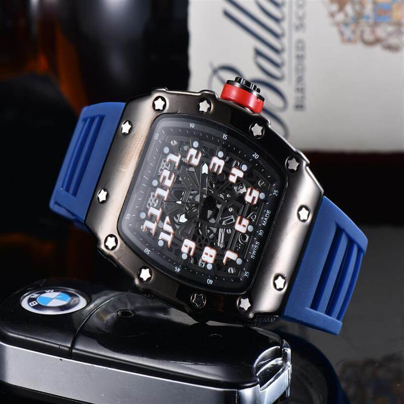 Luxurious black and blue quartz watch with a striking design, placed next to a BMW key fob, ideal for modern style.