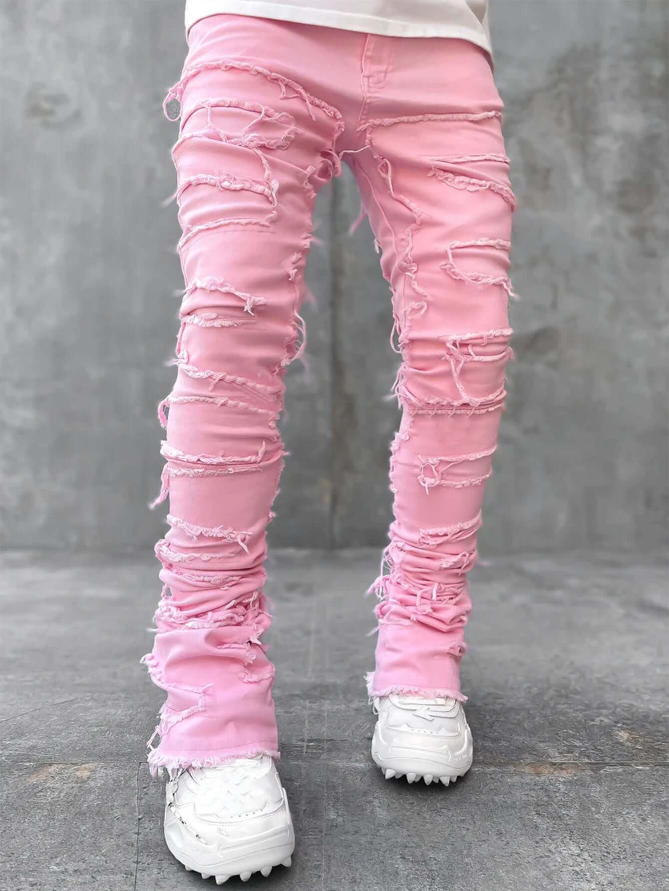 Mens pink ripped jeans featuring a unique stacked design, offering a trendy and stylish look for casual wear.