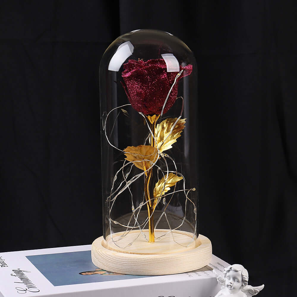 Eternal rose in glass dome with LED lights, romantic decoration for gifts and special occasions.