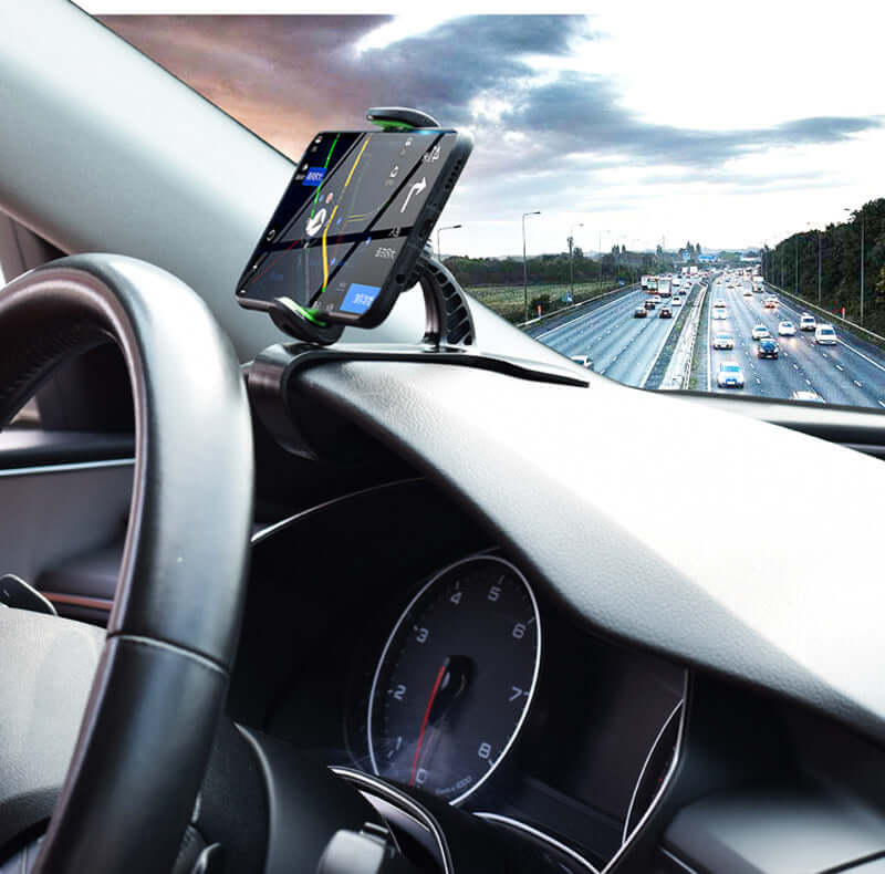 360 Degree Rotation Universal Car Phone Holder mounted on dashboard, displaying GPS navigation while driving on highway.