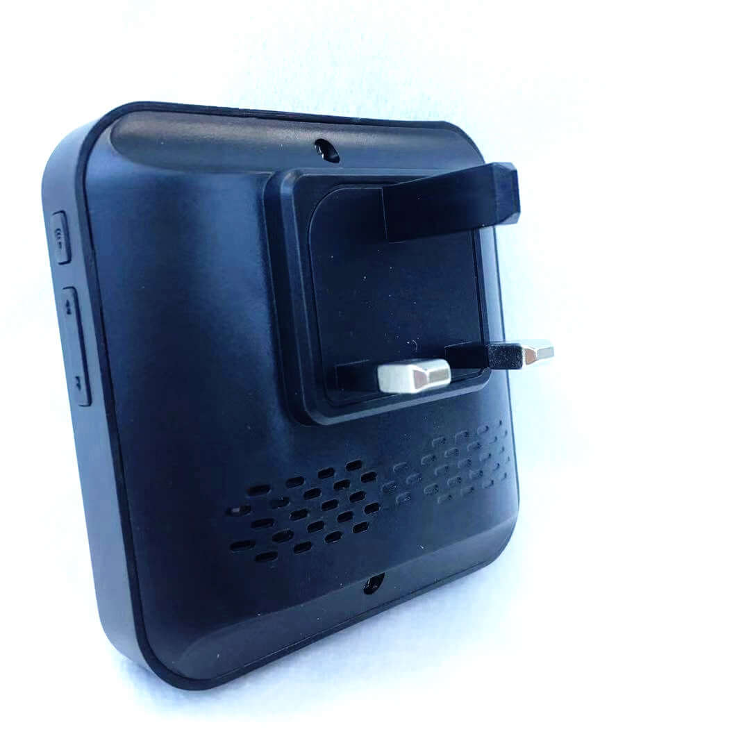 Black wireless doorbell power adapter with plug and configuration buttons.