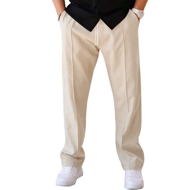Men's beige casual trousers with straight leg design, drawstring, and slightly elastic material for comfortable wear.
