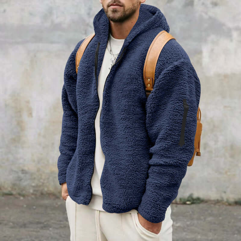 Men's plush hooded jacket in dark blue fleece, casual outerwear perfect for autumn and winter, styled with a backpack.