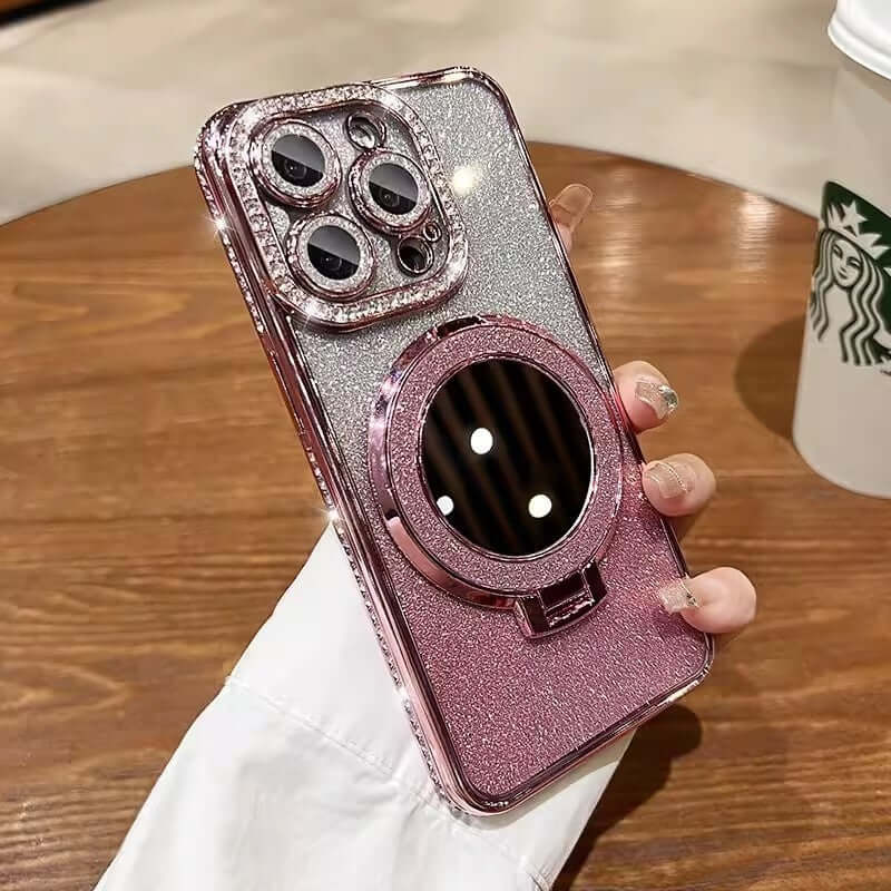 Glittery phone case with a makeup mirror, showcasing pink and silver gradient design, compatible with various iPhone models.