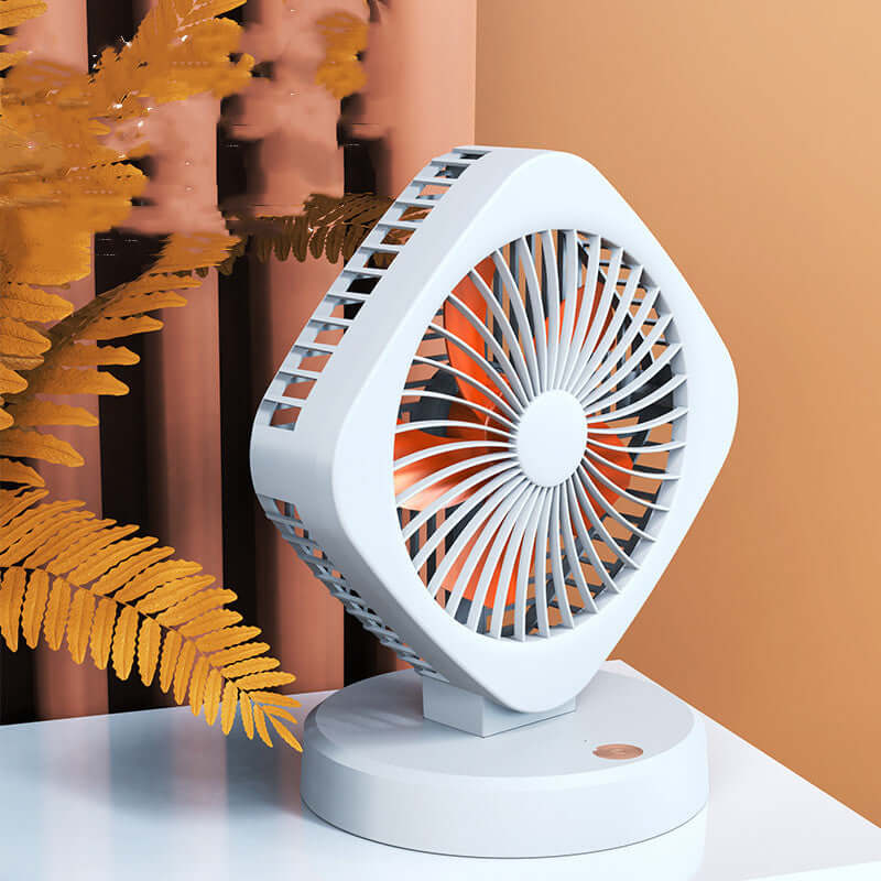 USB desk fan in white with orange blades, featuring versatile design and built-in battery, perfect for cooling anywhere.
