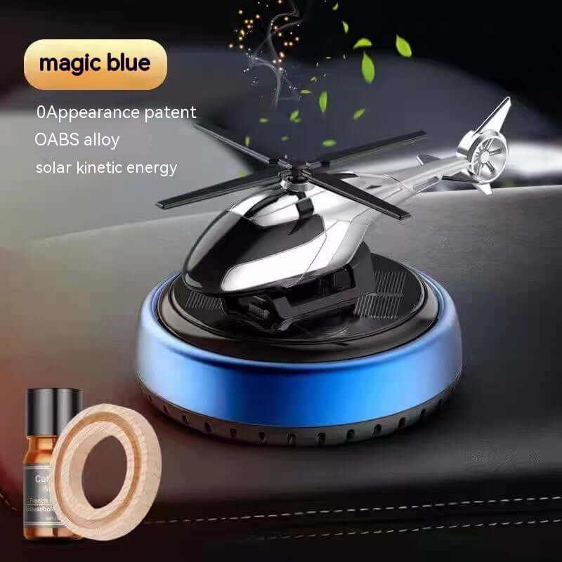 Aromatherapy helicopter drone with solar kinetic energy, blue base, and essential oil bottle for modern decor.