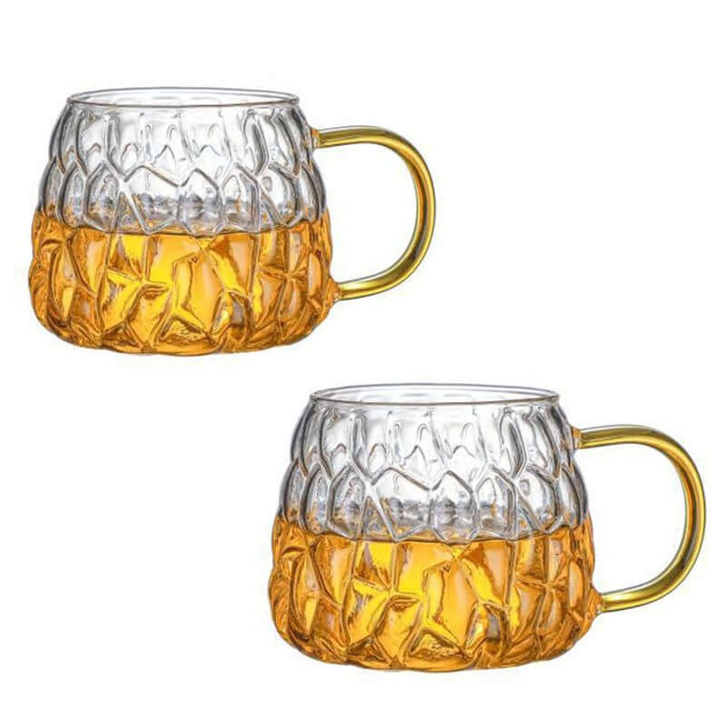Set of two whiskey glasses with a textured pineapple design, perfect for cocktails and beverages.