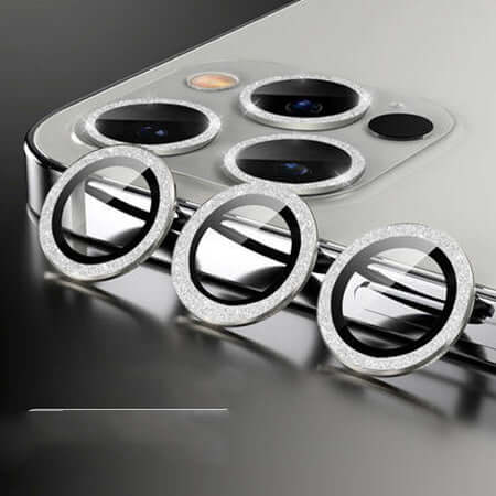 Elegant integrated steel ring mobile phone lens covers in flash diamond silver, enhancing camera aesthetics.