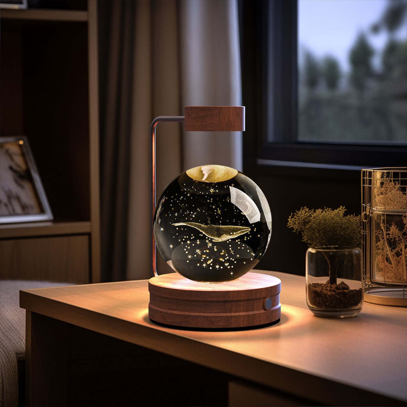 Crystal ball cosmic dinosaur night light on wooden base, creating a warm atmosphere indoors, perfect for gifting.