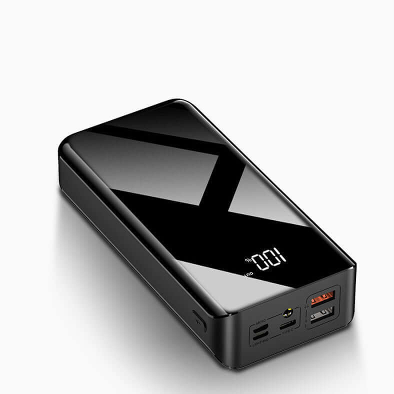 Black 30000mAh power bank with LCD digital display and multiple USB ports, perfect for charging various electronic devices.
