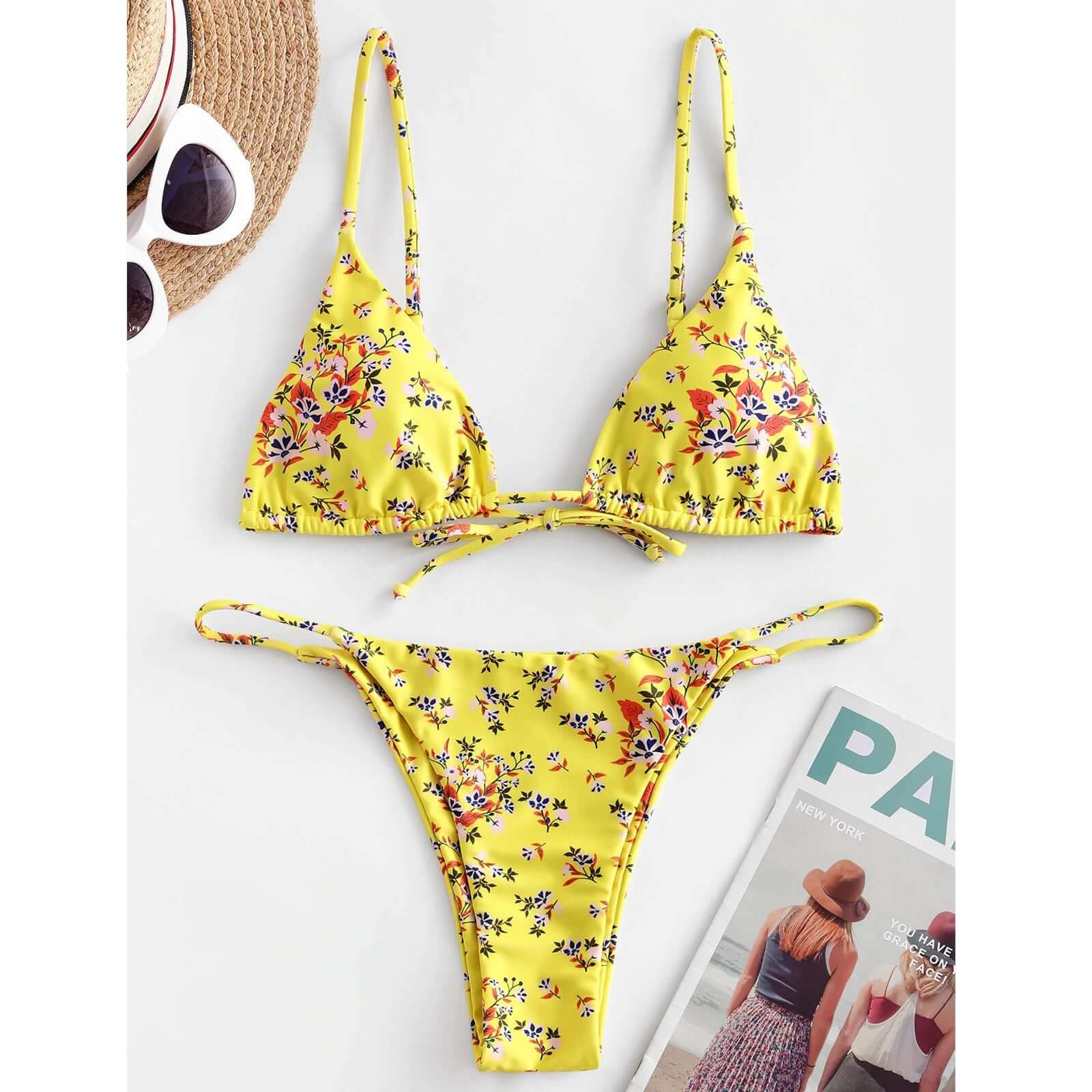 Bright yellow bikini with floral print, perfect for summer beach outings and stylish swimming.