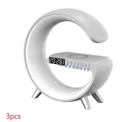 G-shaped LED lamp with Bluetooth speaker and wireless charger for home decor and bedside use.