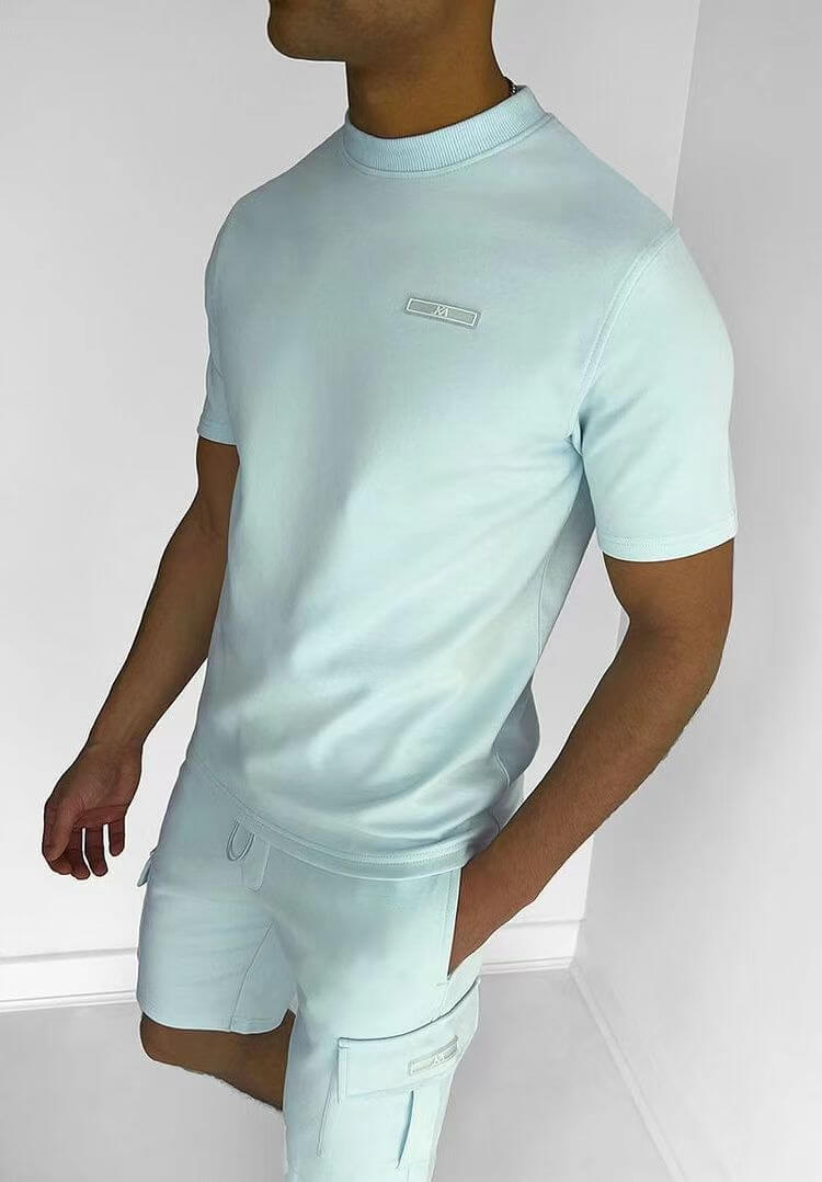 Men's light blue casual sports t-shirt and shorts suit with multi-pocket design, perfect for athletic activities.