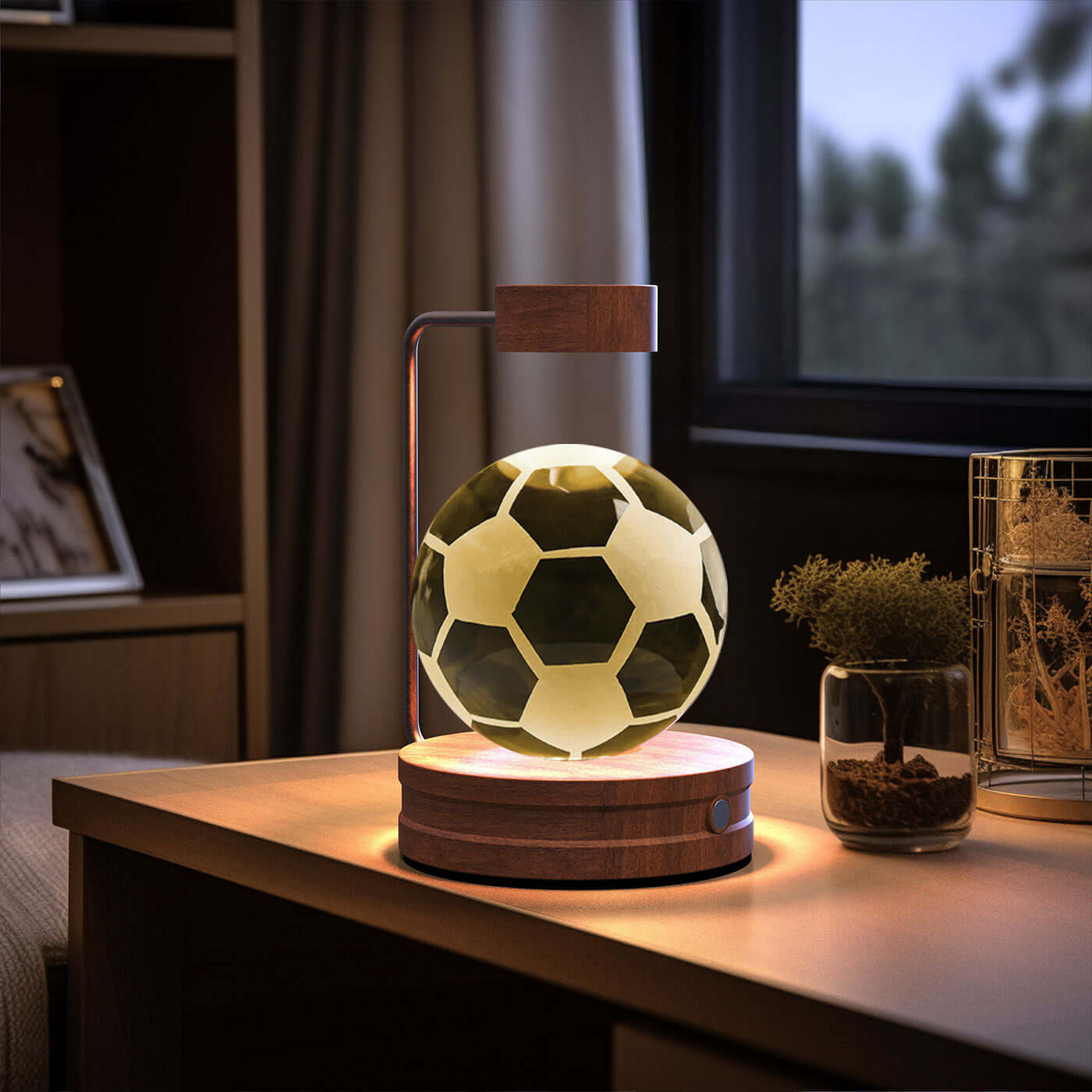 LED soccer ball lamp on a wooden bedside table, creating a warm atmosphere for sports enthusiasts.