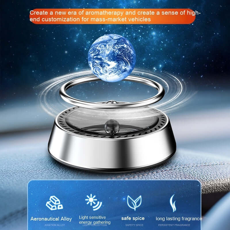 Solar energy rotating car aromatherapy ornament in silver with floating planet design for car interior.