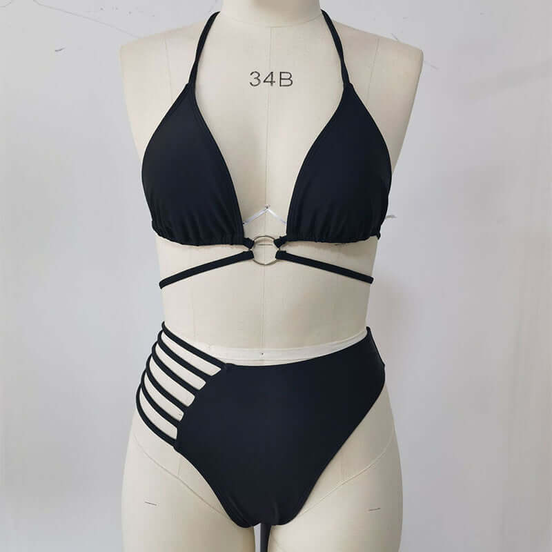 Stylish black two-piece bikini with halter neck and cutout design, perfect for summer beach outings.