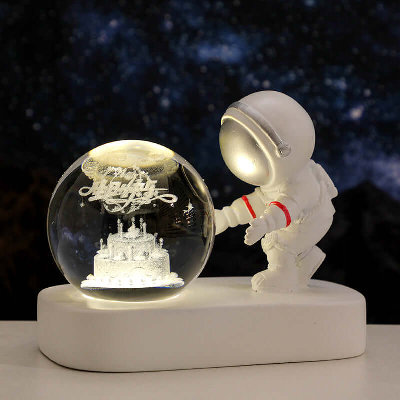 Glowing astronaut figurine beside a illuminated crystal ball night light, perfect for home decor and gifting.