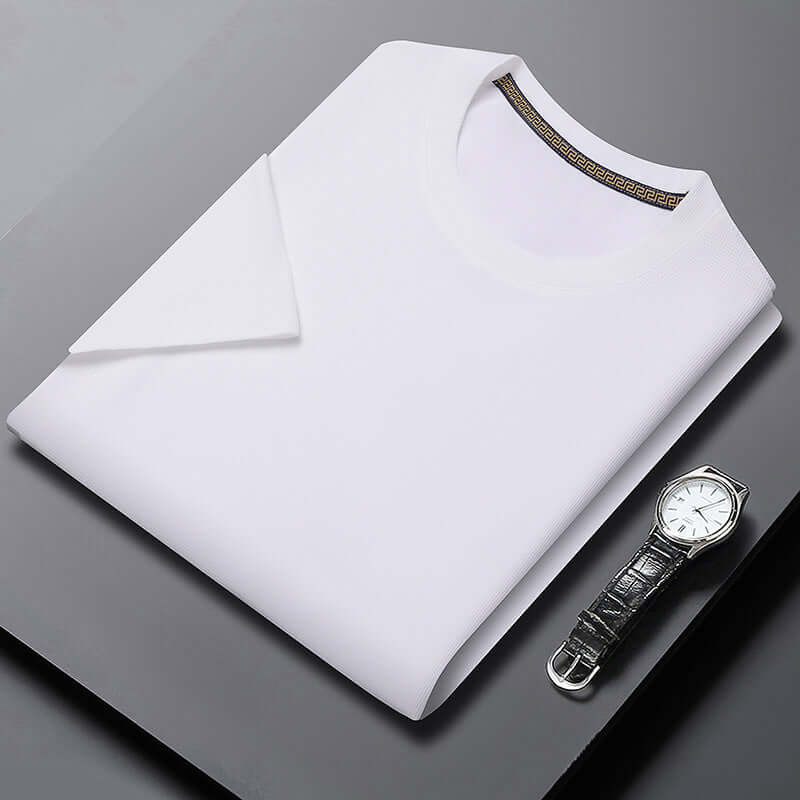 Men's white round neck breathable half sleeve top with stylish collar, paired with a classic wristwatch.