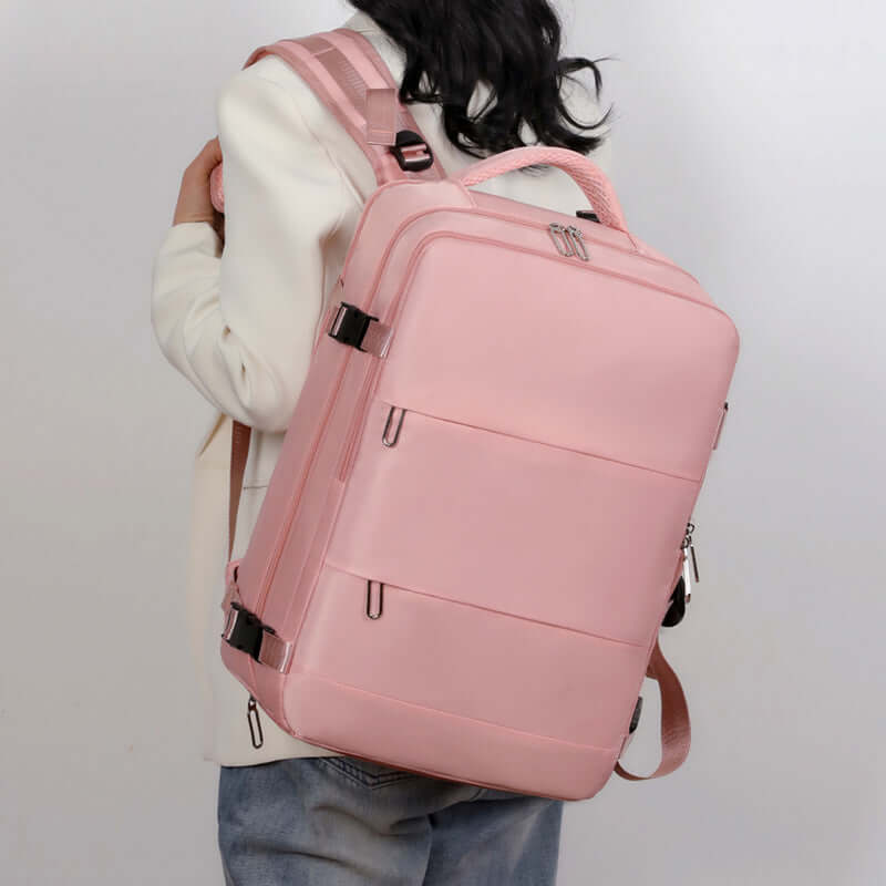 Stylish pink large-capacity travel backpack for women, ideal for college and business with a minimalist design.