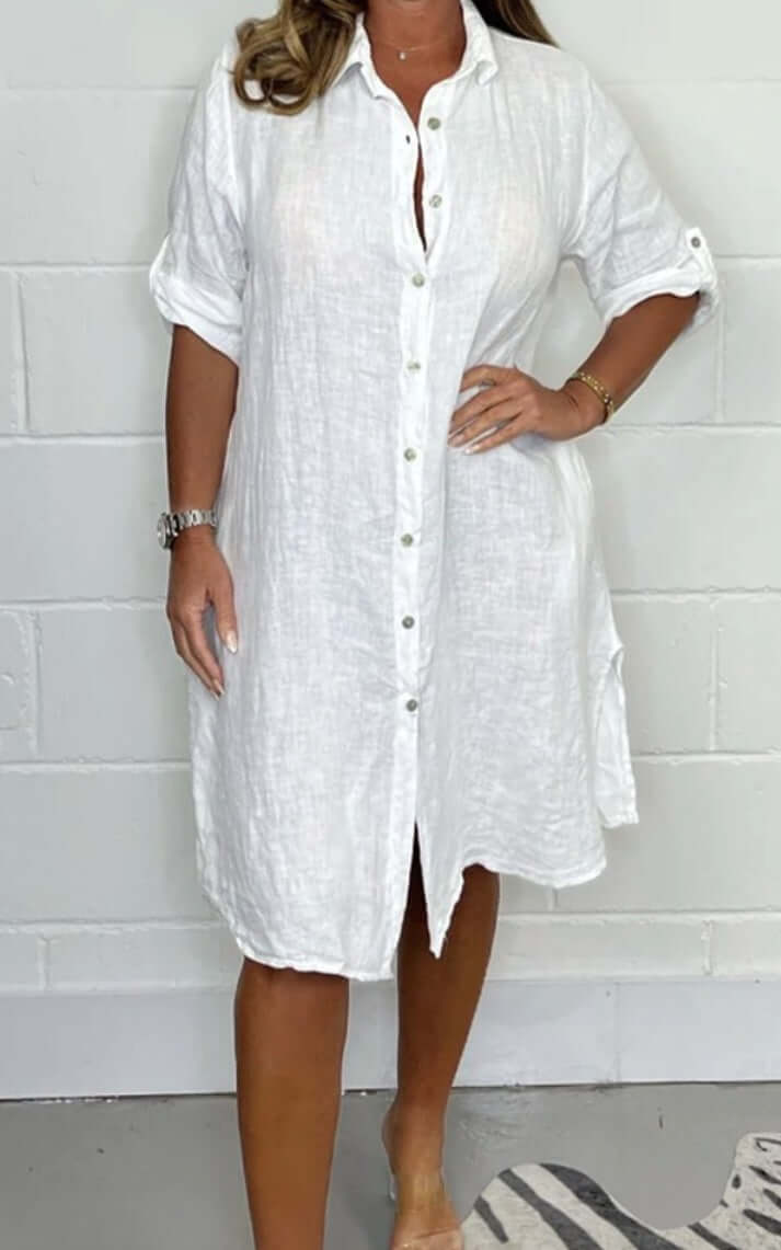 Loose casual half sleeve white cotton linen shirt dress with button details and A-line cut for women.