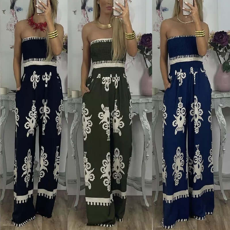 Three women modeling high waisted wrapped chest printed jumpsuits in blue, green, and black with intricate designs.