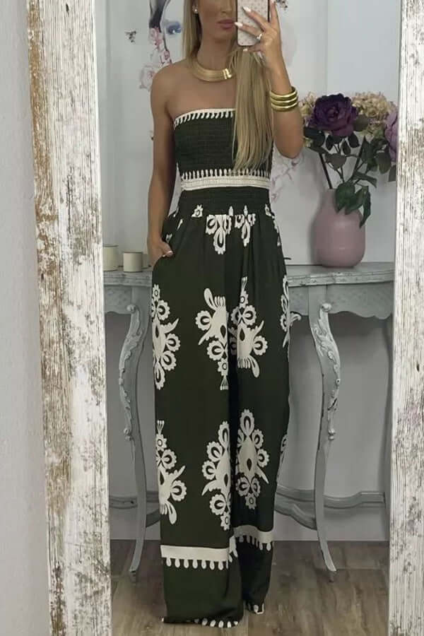 Woman wearing a wrapped chest printed jumpsuit with high-waisted casual pants in green, featuring floral designs.