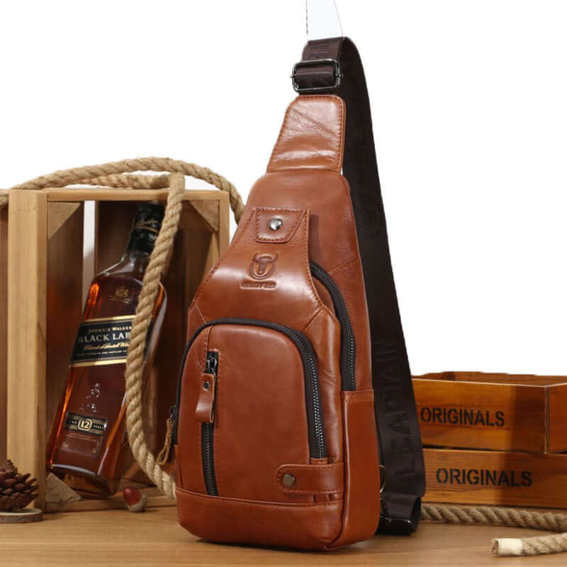 Brown leather street casual large-capacity messenger bag with multiple pockets and zipper, perfect for everyday use.
