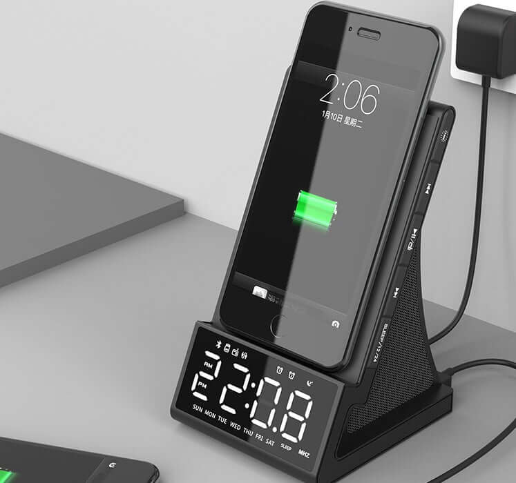 Bluetooth charging alarm clock with phone dock and digital display, showing time and battery charging status.