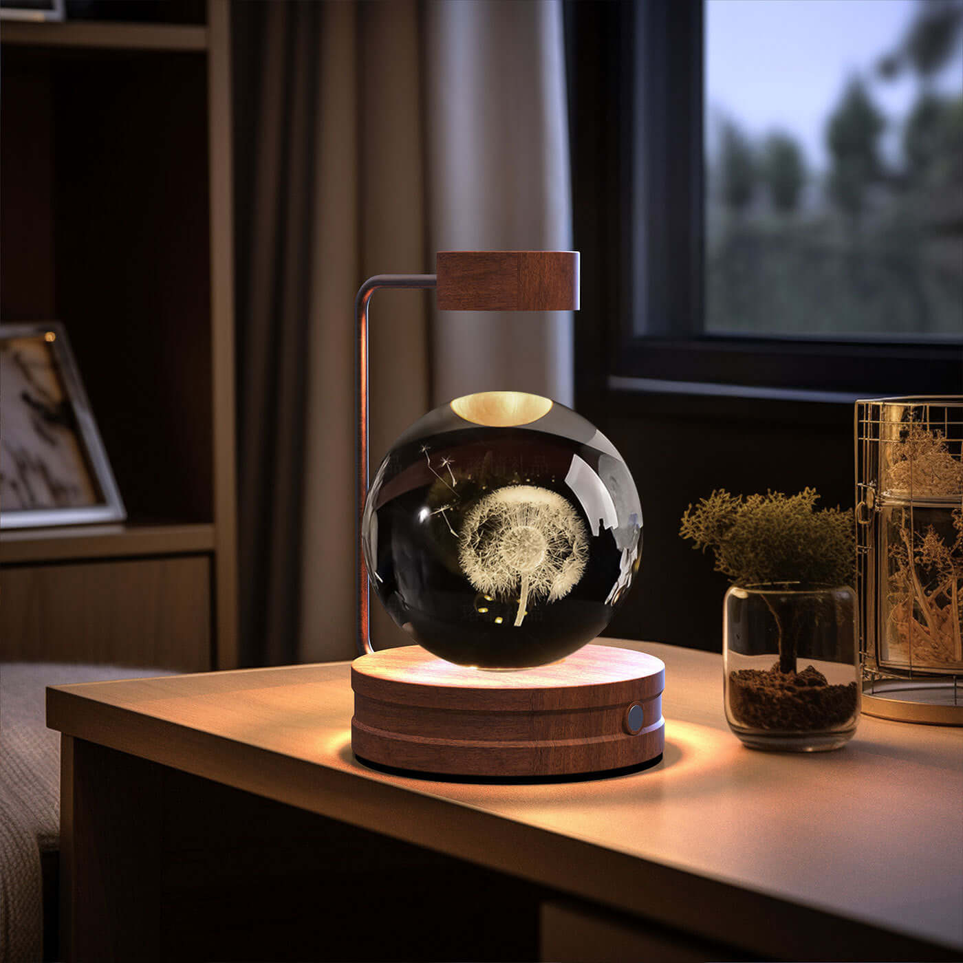 Crystal ball night light with wooden base, creating a warm ambiance for a cozy indoor setting.
