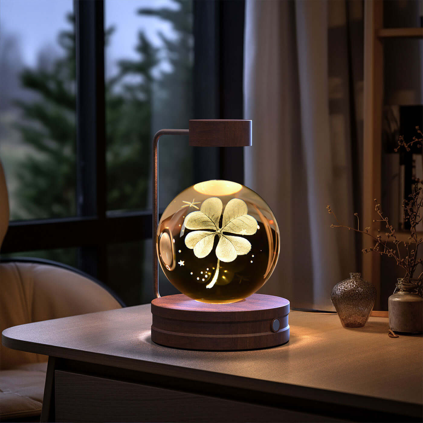Crystal ball night light with floral design, creating a warm atmosphere for home decor.
