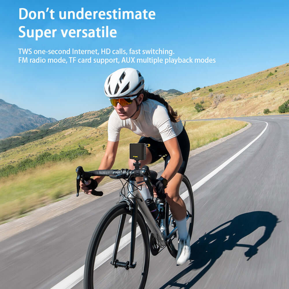 Cyclist on a winding road using a versatile Bluetooth speaker with features like TWS, HD calls, and multiple playback modes.