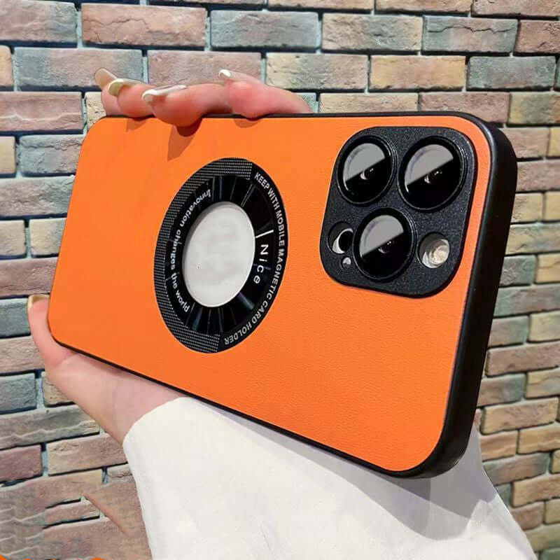 Orange imitation leather iPhone 15 Pro case with magnetic attraction and anti-fall design, held in hand.