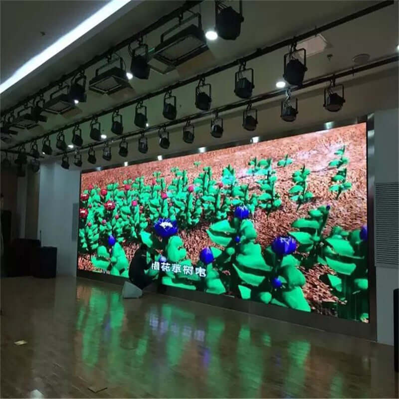 P3 indoor full-color HD LED display rental screen showcasing vibrant floral graphics in a modern venue.