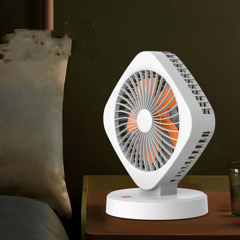 USB desk fan in orange and white, featuring a stylish design and compact size for versatile use.