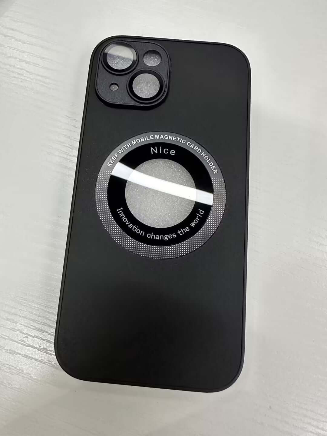 Black phone case with magnetic design and embossed 'Nice' label, showcasing innovation and style.