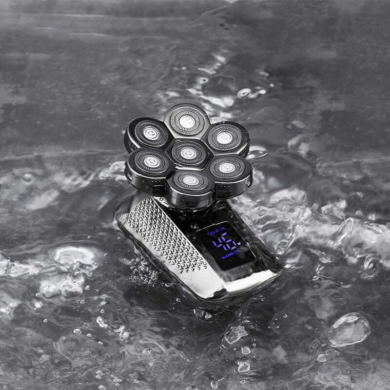 Men's whole body washable electric razor with float heads and LED display immersed in water.