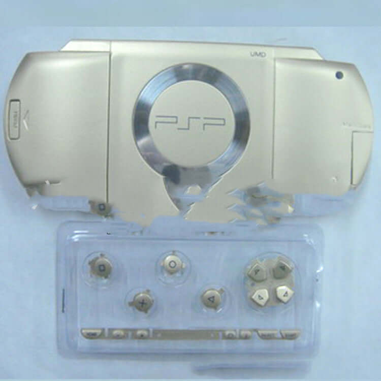 PSP1000 handheld gaming console protective housing in gold color with additional buttons and accessories.