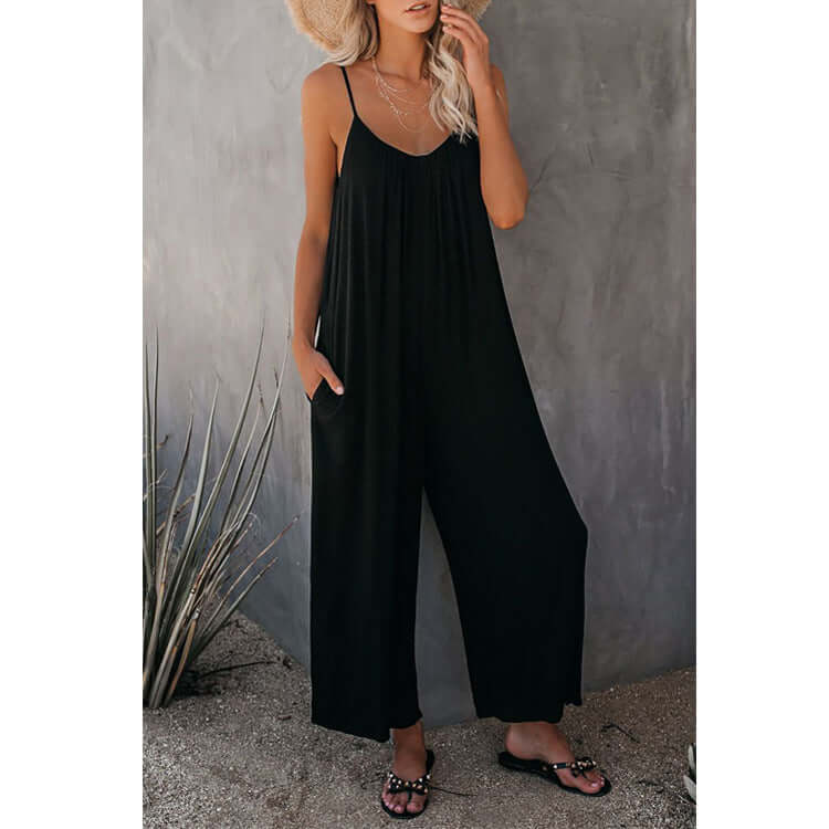 Women's loose sleeveless black jumpsuit romper with pockets, perfect for summer casual wear.