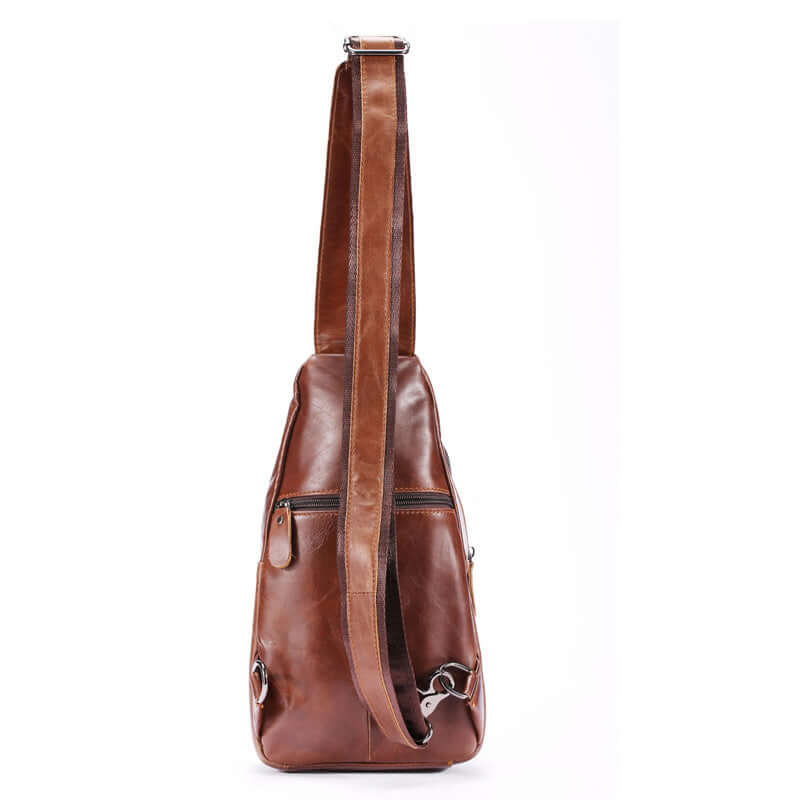 Brown cowhide leather crossbody bag for men, stylish minimalist design with adjustable strap and zipper pockets.