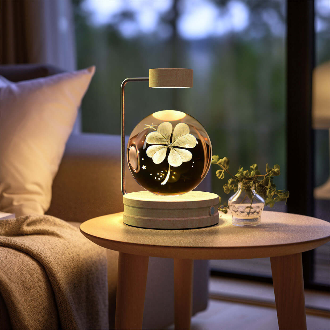 Crystal ball night light with a floral design on a wooden table, creating a cozy atmosphere in a modern living room.