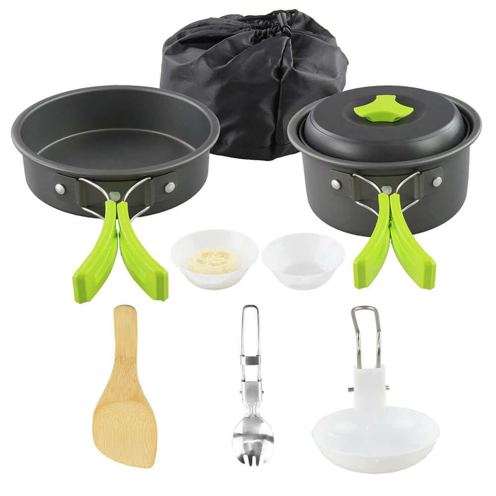 Portable camping cookware set with green handles, including pots, bowls, utensils, and storage bag for outdoor cooking.
