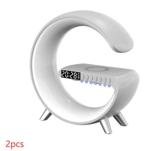 G-shaped LED lamp with Bluetooth speaker and wireless charger, displaying time on digital clock, perfect for home decor.